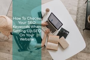 woman sitting on a laptop on a desk identifying How To Choose Your SEO Keywords When Setting Up SEO On Your Website